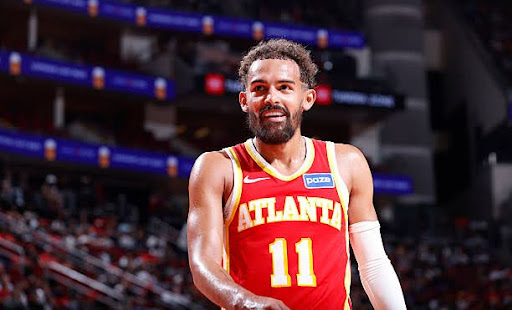 HOUSTON, TX - OCTOBER 6:  Trae Young #11 of the Atlanta Hawks smiles during the game against the Houston Rockets   during a preseason game on October 6, 2025 at the Toyota Center in Houston, Texas. NOTE TO USER: User expressly acknowledges and agrees that, by downloading and or using this photograph, User is consenting to the terms and conditions of the Getty Images License Agreement. Mandatory Copyright Notice: Copyright 2025 NBAE (Photo by Logan Riely/NBAE via Getty Images)