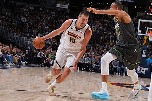 DENVER, CO - APRIL 1: Nikola Jokic #15 of the Denver Nuggets drives to the basket during the game against the Minnesota Timberwolves on April 1, 2025 at Ball Arena in Denver, Colorado. NOTE TO USER: User expressly acknowledges and agrees that, by downloading and/or using this Photograph, user is consenting to the terms and conditions of the Getty Images License Agreement. Mandatory Copyright Notice: Copyright 2025 NBAE (Photo by Bart Young/NBAE via Getty Images)