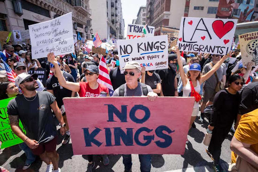 TOPSHOT - Demonstrators take part in a protest against the Trump administration during the "No Kings" national rally in downtown Los Angeles, California, on June 14, 2025, on the same day as President Trump's military parade in Washington, DC. Tens of thousands of protesters rallied nationwide Saturday against Donald Trump ahead of a huge military parade on the US president's 79th birthday -- as the killing of a Democratic lawmaker underscored the deep divisions in American politics. "No Kings" demonstrators took to the streets in New York, Los Angeles, Chicago, Philadelphia, Houston, Atlanta and hundreds of other cities across the United States to condemn what they call Trump's dictatorial overreach. (Photo by RINGO CHIU / AFP) (Photo by RINGO CHIU/AFP via Getty Images)