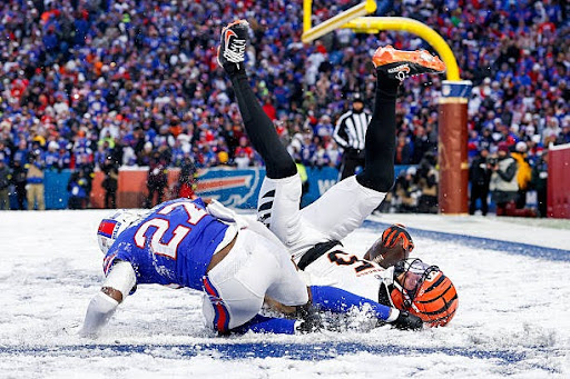 ORCHARD PARK, NEW YORK - DECEMBER 7: Tee Higgins #5 of the Cincinnati Bengals catches a touchdown during the fourth quarter of the NFL 2025 game against the Buffalo Bills at Highmark Stadium on December 7, 2025 in Orchard Park, New York. (Photo by Lauren Leigh Bacho/Getty Images)