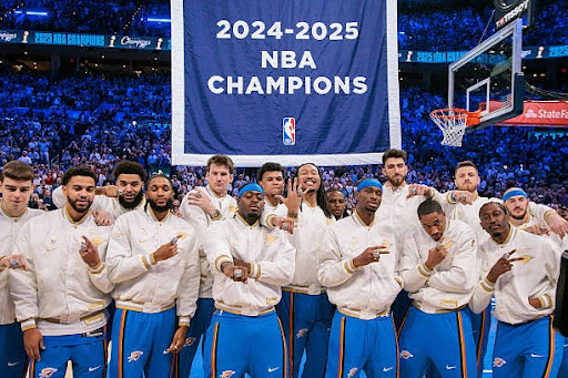OKLAHOMA CITY, OKLAHOMA - OCTOBER 21: Oklahoma City Thunder players pose with their rings in front of the championship banner prior to the game against the Houston Rockets at Paycom Center on October 21, 2025 in Oklahoma City, Oklahoma. (Photo by William Purnell/Getty Images)