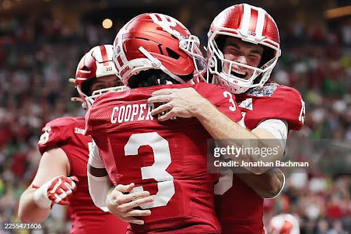 ATLANTA, GEORGIA - JANUARY 09: Fernando Mendoza #15 of the Indiana Hoosiers celebrates with Omar Cooper Jr. #3 of the Indiana Hoosiers after a touchdown in the 2025 College Football Playoff Semifinal at the Chick-fil-A Peach Bowl at Mercedes-Benz Stadium on January 09, 2026 in Atlanta, Georgia. (Photo by Jonathan Bachman/Getty Images)