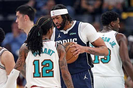 MEMPHIS, TENNESSEE - APRIL 18: Anthony Davis #3 of the Dallas Mavericks and Ja Morant #12 of the Memphis Grizzlies react during the first half of the Play-In Tournament at FedExForum on April 18, 2025 in Memphis, Tennessee. NOTE TO USER: User expressly acknowledges and agrees that, by downloading and or using this photograph, User is consenting to the terms and conditions of the Getty Images License Agreement. (Photo by Justin Ford/Getty Images)