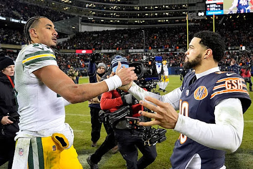 CHICAGO, ILLINOIS - JANUARY 10: (L-R) Jordan Love #10 of the Green Bay Packers embraces Caleb Williams #18 of the Chicago Bears after the NFC Wild Card Playoff game at Soldier Field on January 10, 2026 in Chicago, Illinois.  (Photo by Patrick McDermott/Getty Images)