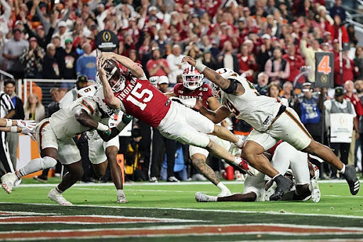 Fernando Mendoza #15 of the Indiana Hoosiers dives for a fourth quarter touchdown against the Miami Hurricanes in the 2026 College Football Playoff National Championship at Hard Rock Stadium on January 19, 2026 in Miami Gardens, Florida.  (Photo by Carmen Mandato/Getty Images)