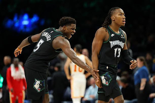 MINNEAPOLIS, MINNESOTA - FEBRUARY 09: Anthony Edwards #5 of the Minnesota Timberwolves celebrates with teammate Ayo Dosunmu #13 in the second quarter against the Atlanta Hawks at Target Center on February 09, 2026 in Minneapolis, Minnesota. NOTE TO USER: User expressly acknowledges and agrees that, by downloading and or using this photograph, User is consenting to the terms and conditions of the Getty Images License Agreement. (Photo by David Berding/Getty Images)