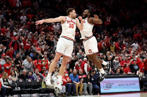 Jamison Battle #10 of the Ohio State Buckeyes is congratulated by Bruce Thornton #2 after making a three point shot during the second half of the game against the Purdue Boilermakers at Value City Arena on February 18, 2024 in Columbus, Ohio. Ohio State defeated Purdue 73-69. (Photo by Kirk Irwin/Getty Images)