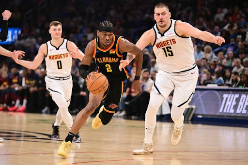 Shai Gilgeous-Alexander #2 of the Oklahoma City Thunder attempts to drive past Nikola Jokic #15 of the Denver Nuggets during the first half at Paycom Center on March 9, 2025 in Oklahoma City, Oklahoma. (Photo by Joshua Gateley/Getty Images)
