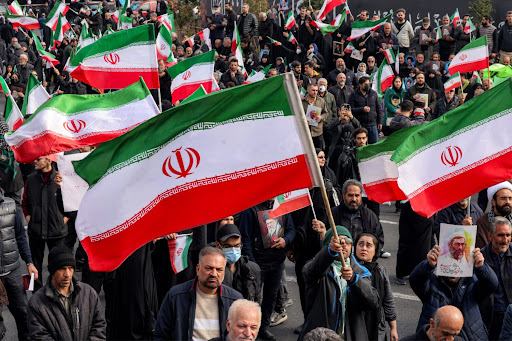 Demonstrators gather with Iranian national flags for a rally in support of the new Supreme Leader at Enghelab Square in central Tehran on March 9, 2026. Iran marked the appointment of Ayatollah Mojtaba Khamenei to replace his father as its supreme leader with a new barrage of missiles against Israel and the Gulf states on Monday, as the Middle East war sent oil prices soaring. (Photo by Atta KENARE / AFP via Getty Images)