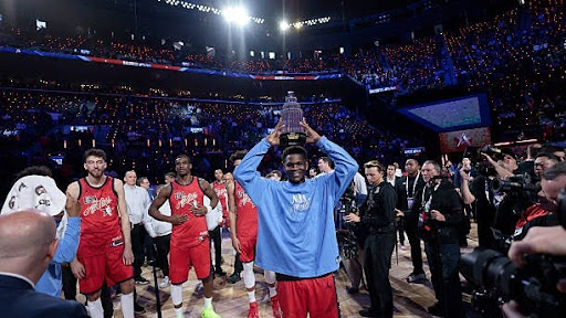 Anthony Edwards holding the All-Star Game MVP.