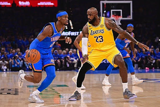 This photo shows LeBron James guarding Shai Gilgeous-Alexander in the 2026 playoffs.